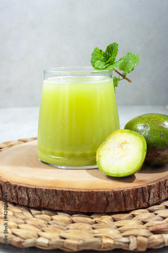 Jus kedondong. Ambarella or jew plum or kedondong juice in glass. Jus kedondong. Ambarella or jew plum or kedondong juice in glass.