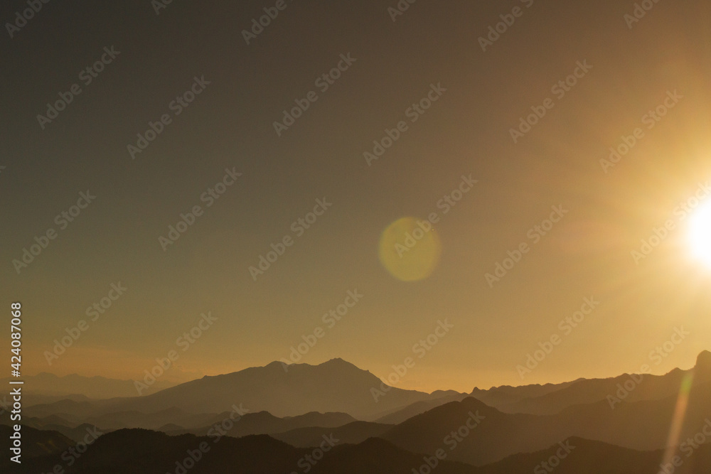 sunset with montain chain silhouette sunset with montain chain silhouette