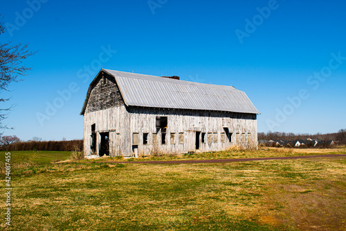 Large wooden barn in field, part of civil war Battle of Chancellorsville