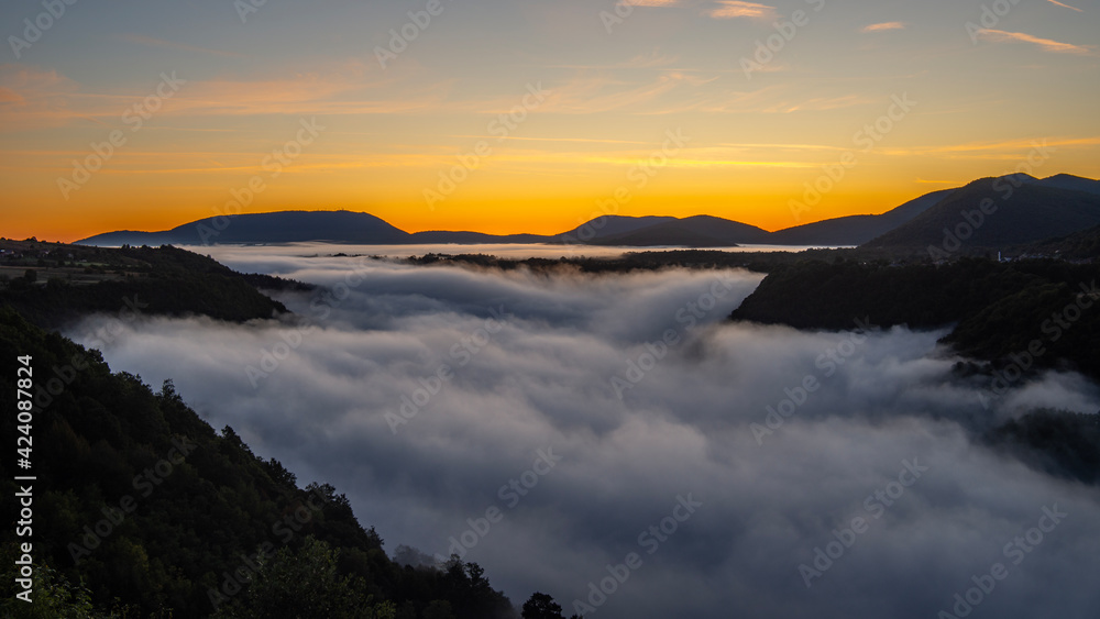Fototapeta premium foggy sunrise in the mountains