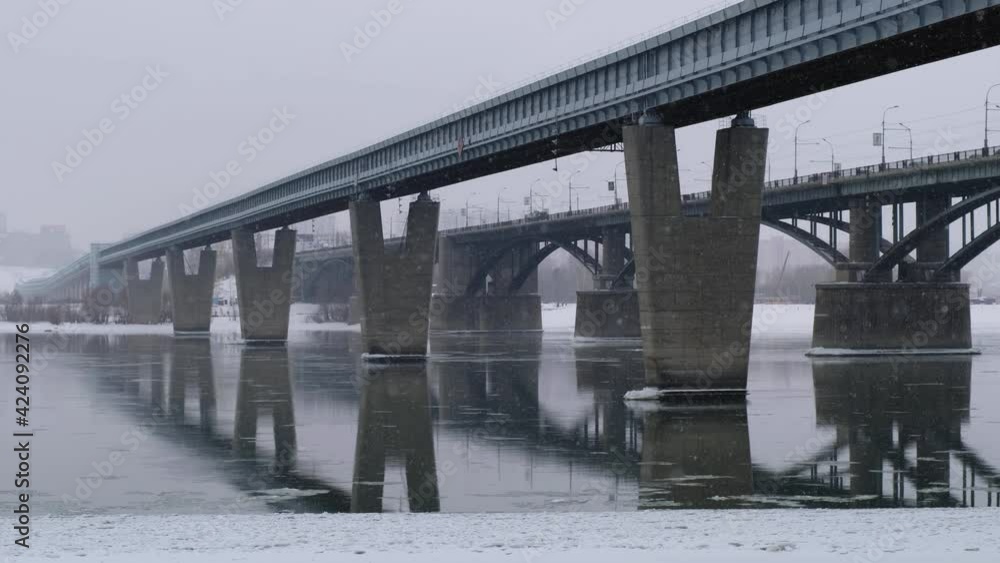Video of the frozen Ob River with road and subway bridges in winter in Novosibirsk. Video of the frozen Ob River with road and subway bridges in winter in Novosibirsk.