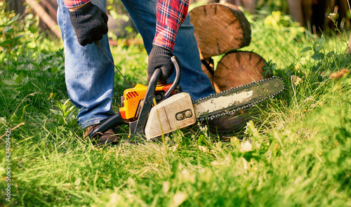 person starting  chainsaw