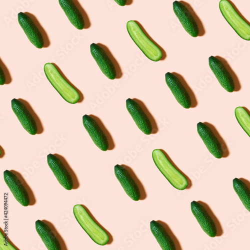 Cucumbers pattern creative on pink background. Top view, flat lay style