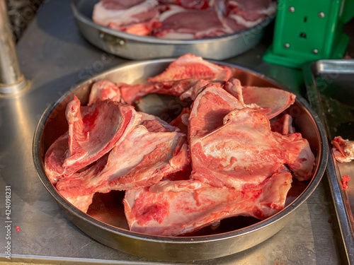 Pile of pork bone for sale at raw meat market 