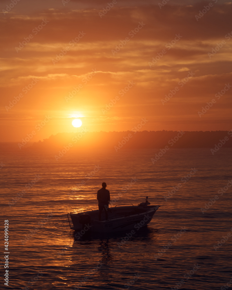 Boat fishing at sunrise