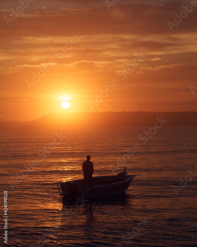 Boat fishing at sunrise © Sheila