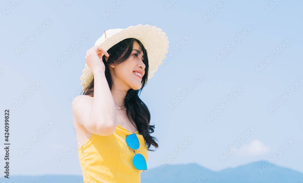 Young Asian woman enjoying summer vacation on the beach Young Asian woman enjoying summer vacation on the beach