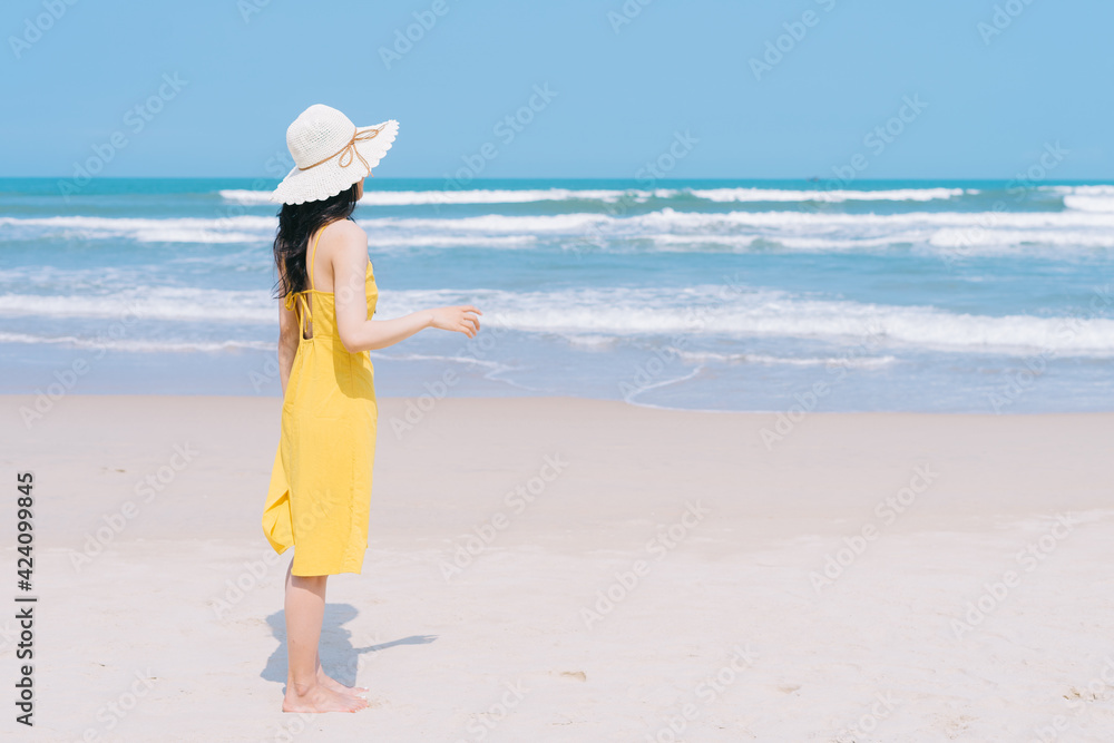 Young Asian woman enjoying summer vacation on the beach Young Asian woman enjoying summer vacation on the beach