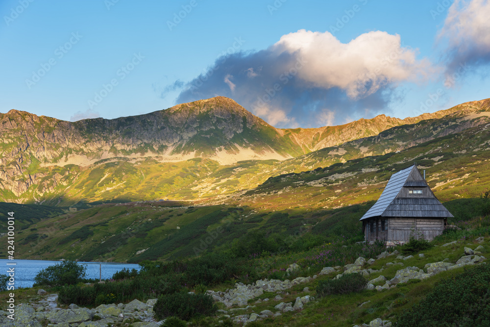 Beautiful views of the Polish High Tatras with mountain lakes and picturesque houses in the summer season