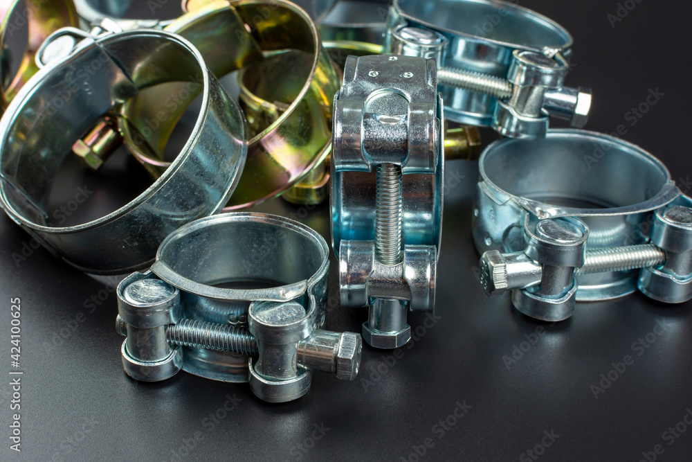 close-up of metal clamps on black background