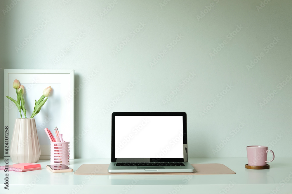 Computer with empty screen on white table at female workplace. Computer with empty screen on white table at female workplace.