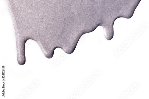 Light gray liquid drops of paint color flow down on white background. Abstract silver backdrop with fluid drip pattern.