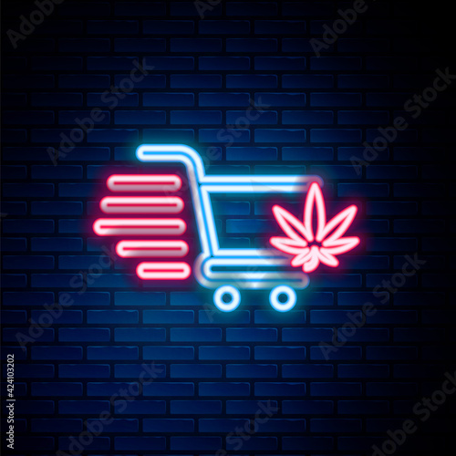 Glowing neon line Shopping cart with marijuana or cannabis leaf icon isolated on brick wall background. Online buying. Delivery service. Supermarket basket. Colorful outline concept. Vector