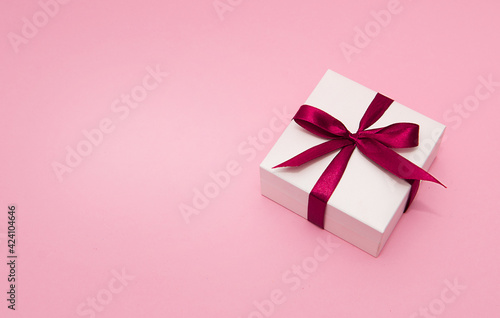 White Gift box with red ribbon and copy space