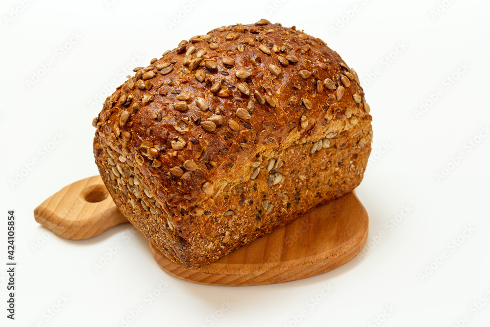 Loaf of bread on wooden cutting board on white background Loaf of bread on wooden cutting board on white background