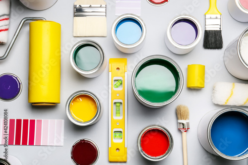 Cans of paints and tools on...