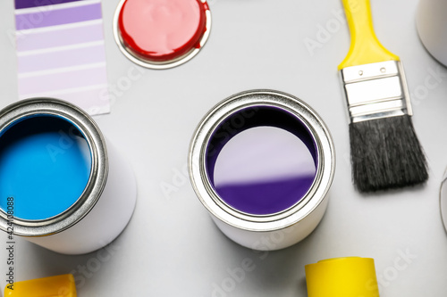 Cans of paints and brush on...