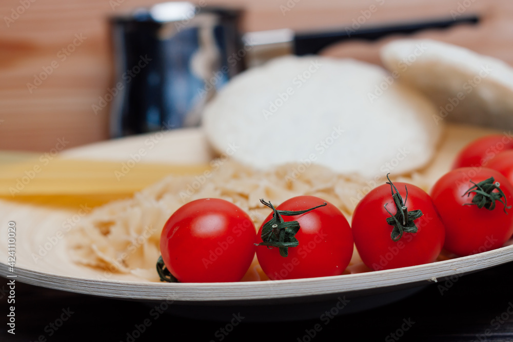 cherry tomatoes on the table italian pasta ingredients cherry tomatoes on the table italian pasta ingredients