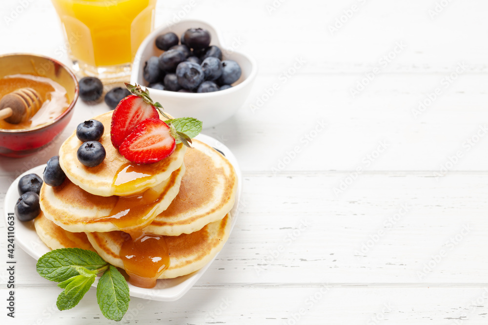 Healthy breakfast with pancakes and orange juice