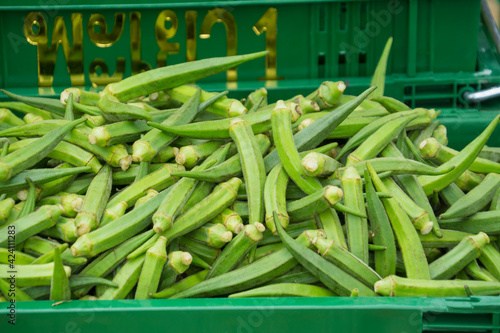 
Whole raw green okra vegetable food background