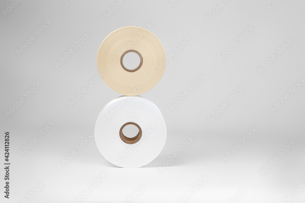 vertical composition of two coils of satin ribbons in the form of the number eight or the infinity sign for tags or handmade in white, beige, isolated on a white, gray background. vertical composition of two coils of satin ribbons in the form of the number eight or the infinity sign for tags or handmade in white, beige, isolated on a white, gray background.