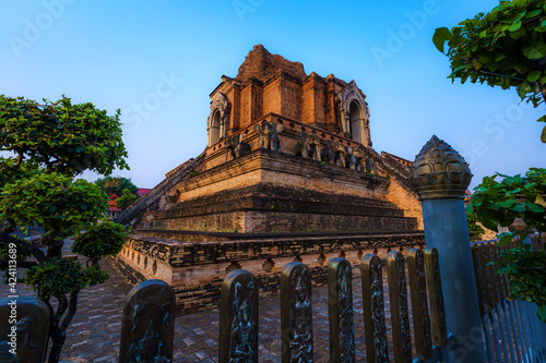 Wat Chedi Luang is a Buddhist temple in the historic centre and is a Buddhist temple is a major tourist attraction in Chiang Mai Thailand.at twilight time blue sky clouds sunset background.
