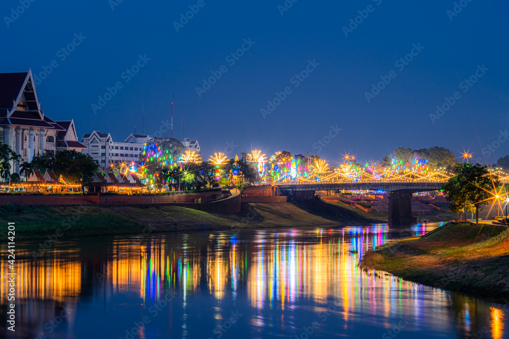Beautiful light on the Nan River at night on the bridge (Naresuan Bridge) on the Road in Realm for Naresuan the Great Festival and Red Cross Annual event in Phitsanulok,Thailand.