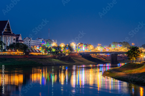 Beautiful light on the Nan River at night on the bridge  Naresuan Bridge  on the Road in Realm for Naresuan the Great Festival and Red Cross Annual event in Phitsanulok Thailand.