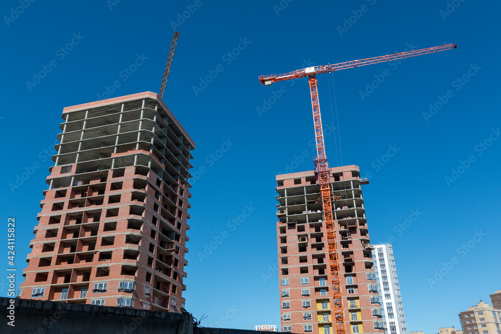 Fototapeta premium Construction of a multi-storey high-rise apartment building