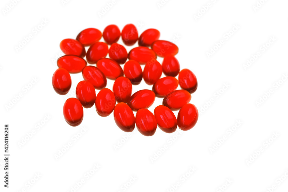 Krill oil red gelatin capsules set on white background.Source of omega fatty acids.Healthy food.krill oil supplements Krill oil red gelatin capsules set on white background.Source of omega fatty acids.Healthy food.krill oil supplements