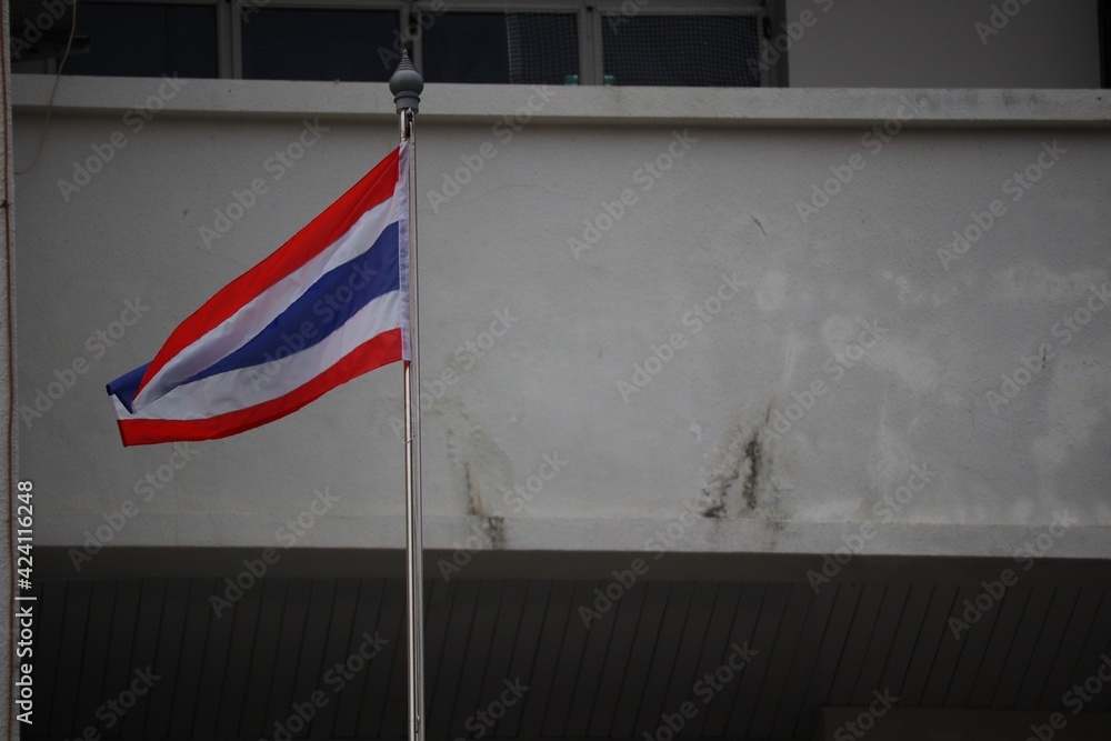 thailand flag in front of a building
