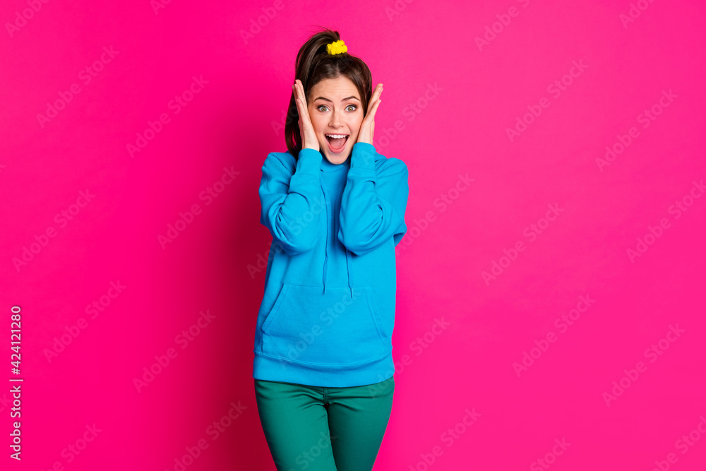 Portrait of astonished young person hands on cheeks open mouth disbelief isolated on pink color background Portrait of astonished young person hands on cheeks open mouth disbelief isolated on pink color background
