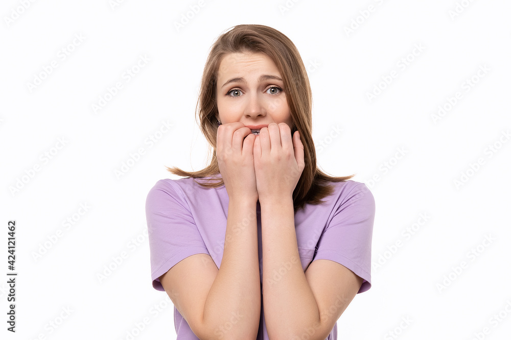 close up shocked young woman covering her mouth with hands, isolated on white background close up shocked young woman covering her mouth with hands, isolated on white background