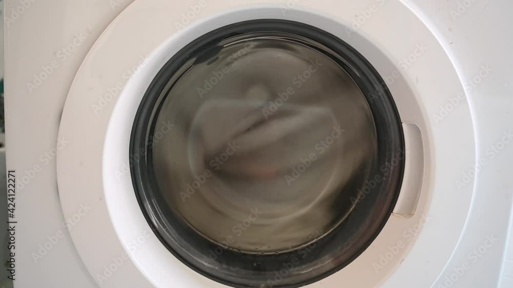 rotating drum washing machine, close up rotating drum washing machine, close up