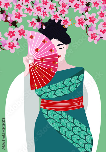 A Japanese girl in a beautiful traditional outfit stands in cherry blossoms.