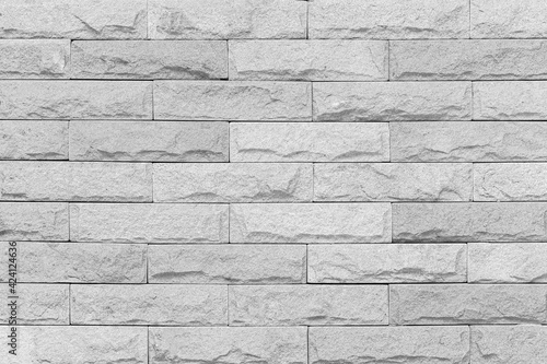 Building exterior white granite block wall texture and background seamless