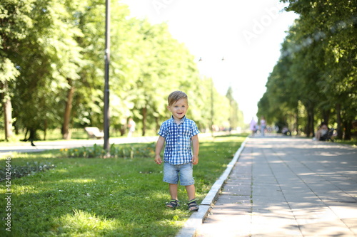 little boy with a water gun. summer water entertainment. the child plays with a water gun