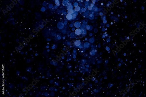 Glittering stars of blue bokeh