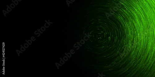 green light particles in a circular rotation