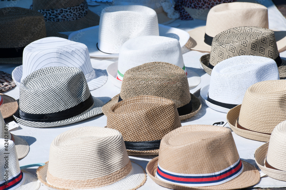 Large quantity of hats for sale in a street market.