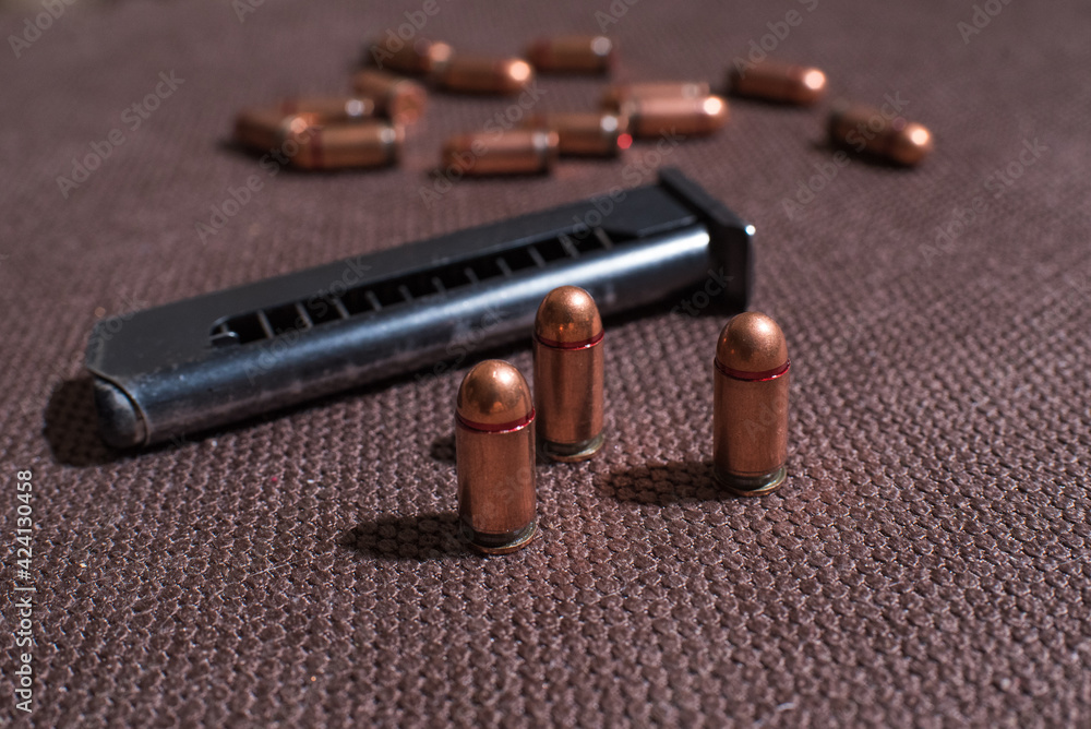 Copper firearms bullets and pistol clips. Weapon Copper firearms bullets and pistol clips. Weapon