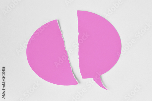 Broken pink speech bubble on white background - Concept of woman and communication problems