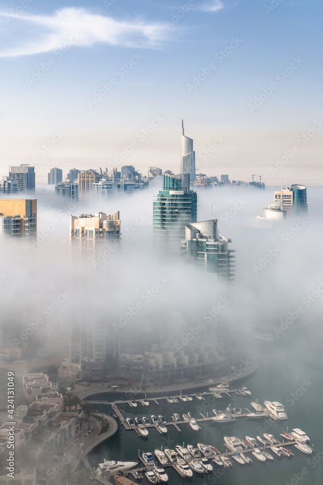 Dubai skyline, aerial top view of towers rooftops in Dubai Marina on a