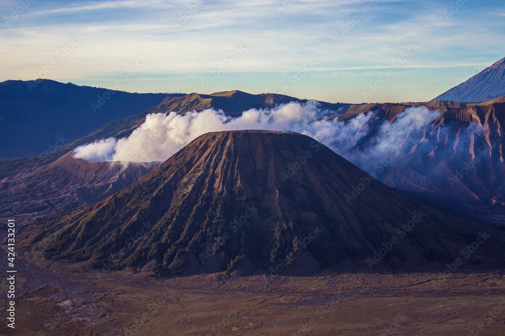 View on Mount Batok dormant volcano and Mount Bromo active volcano at Bromo Tengger Semeru National Park, East Java, Indonesia. View on Mount Batok dormant volcano and Mount Bromo active volcano at Bromo Tengger Semeru National Park, East Java, Indonesia.