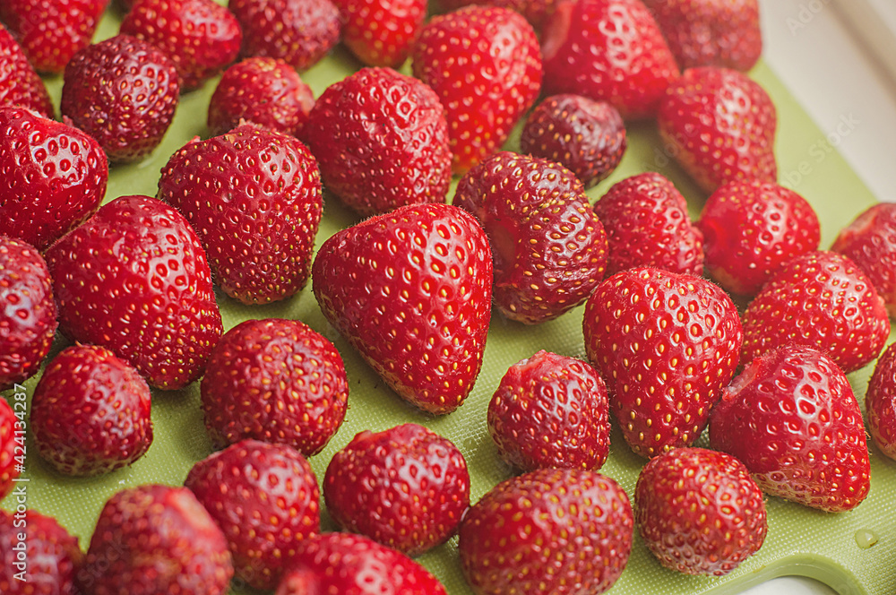 Peeled red ripe strawberries. Summer time background. Peeled red ripe strawberries. Summer time background.