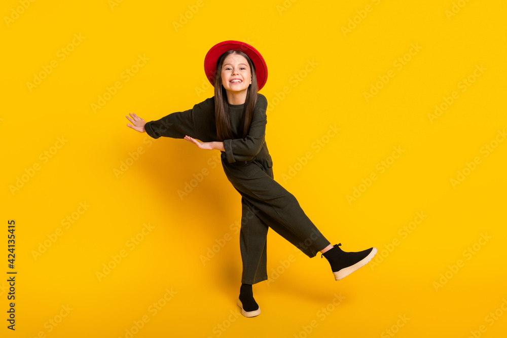Full length body size view of attractive cheerful girl dancing having fun good mood isolated over bright yellow color background