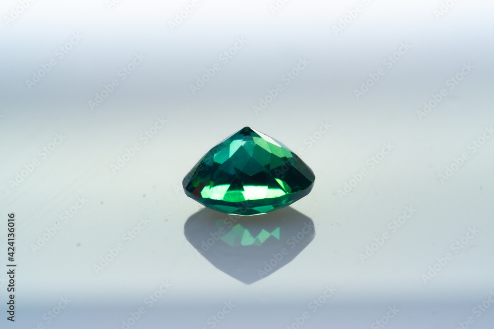 Natural gemstone green sapphire on white background Natural gemstone green sapphire on white background