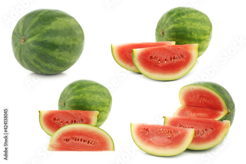 Fresh watermelons and some cut pieces on a white background