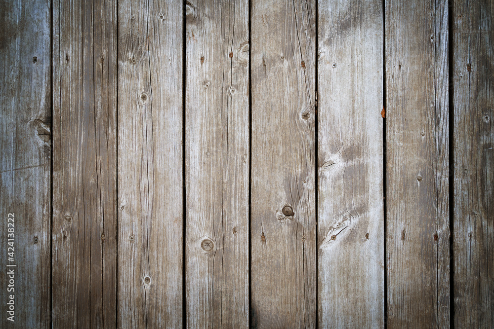 Fototapeta premium Natural old wooden boards background. Dark grey textured vertical wood planks. Copy space, vignette.