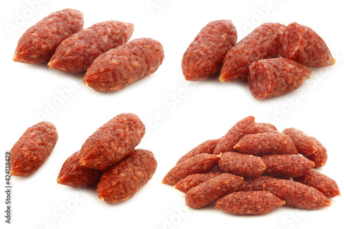 bunch of mini cervelat sausages on a white background
